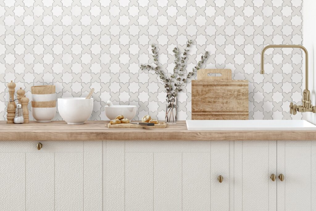 White DUNIN StarCross White Mix Matt mosaic above the countertop in the kitchen with wooden accessories